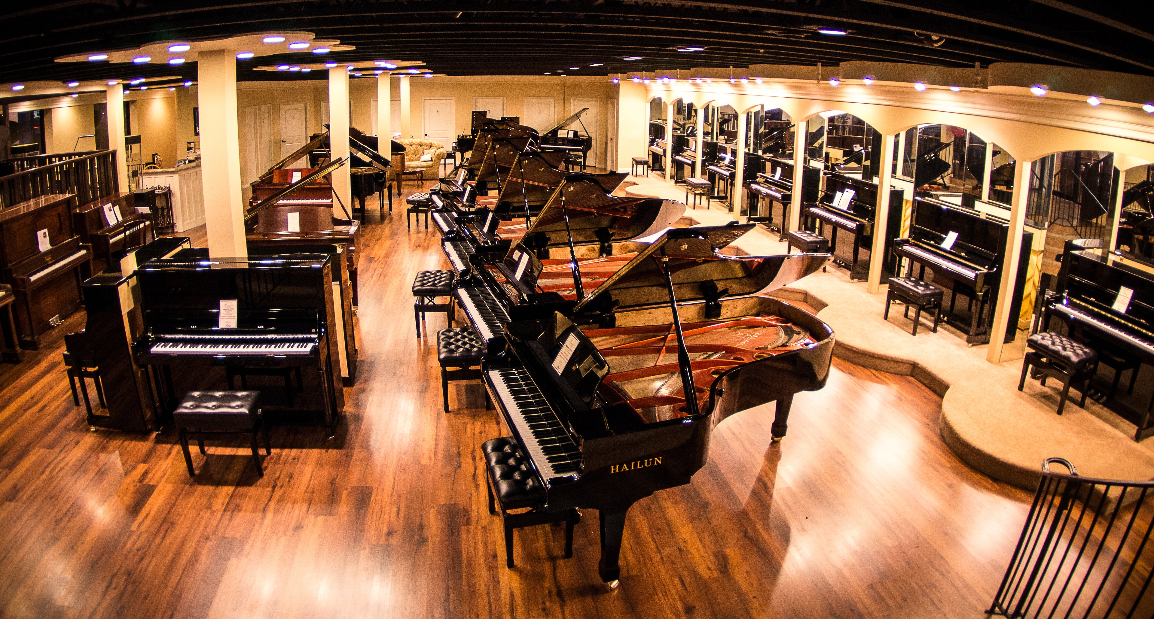 grand and upright piano showroom at Brigham Larson Pianos
