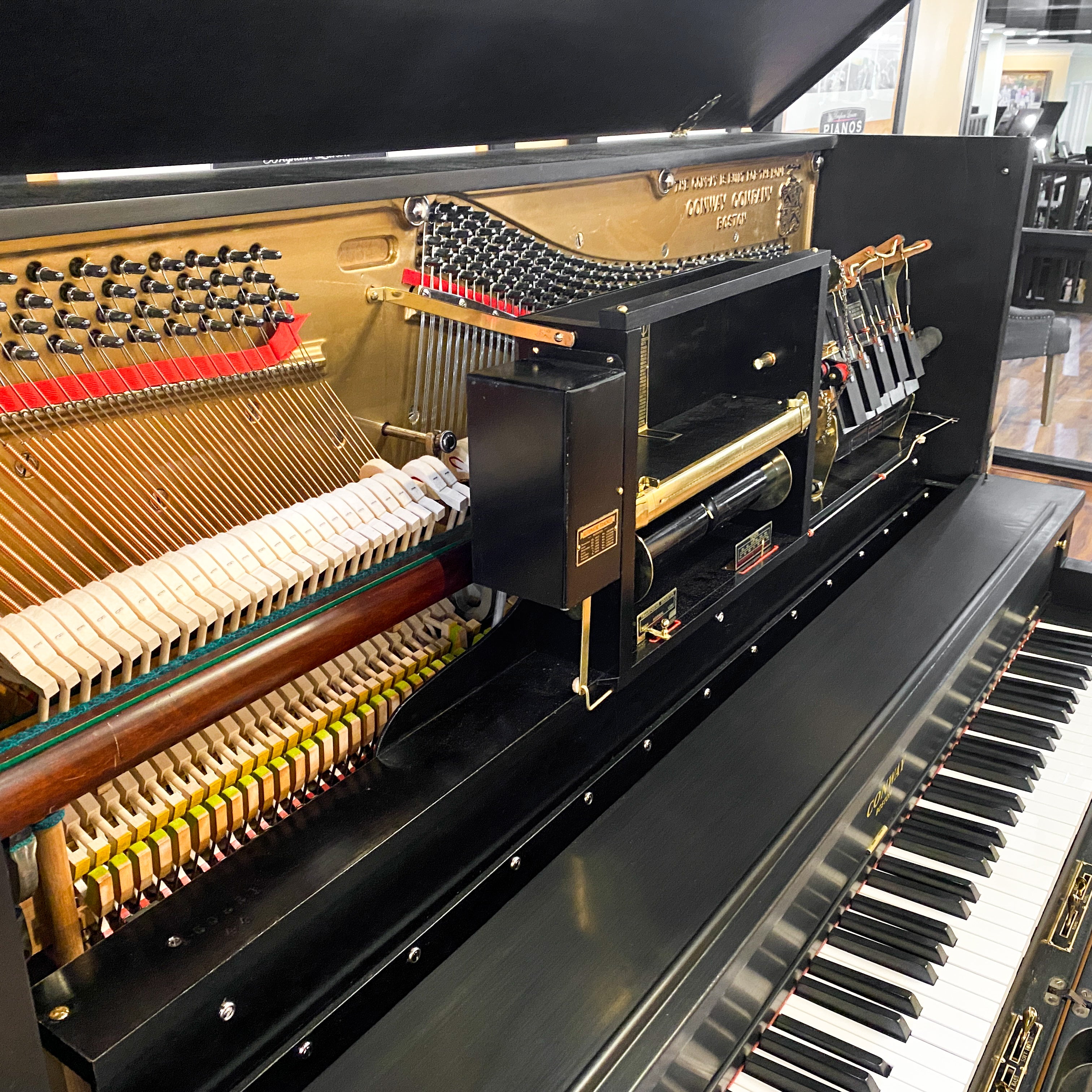 Beautifully restored heirloom hundred year old Conway restoration vintage pnumatic player piano rebuild at Brigham Larson Pianos family heirloom piano restoration shop.