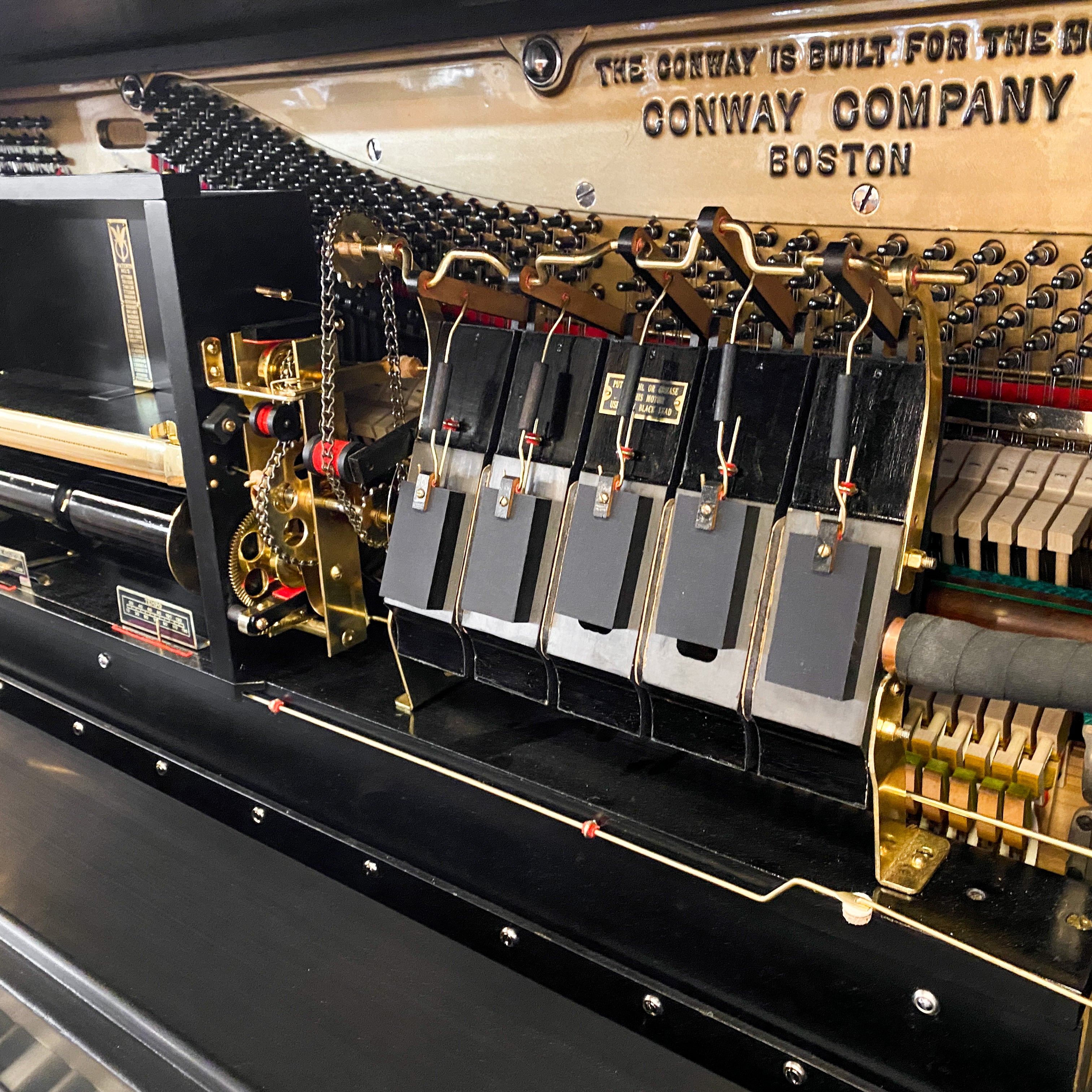 Beautifully restored heirloom hundred year old Conway restoration vintage pnumatic player piano rebuild at Brigham Larson Pianos family heirloom piano restoration shop.