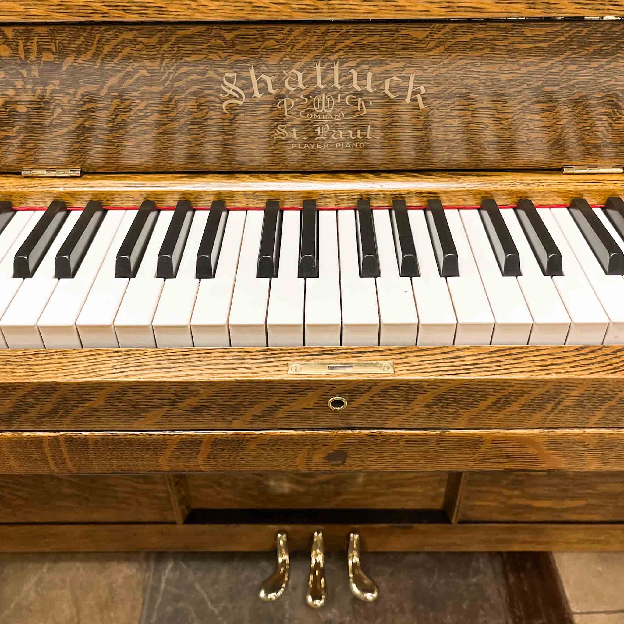 Beautiful upright heirloom hundred year old piano Shattuck vintage pnumatic player piano after restoration at Brigham Larson Pianos Family heirloom restoration shop in Orem, Utah.
