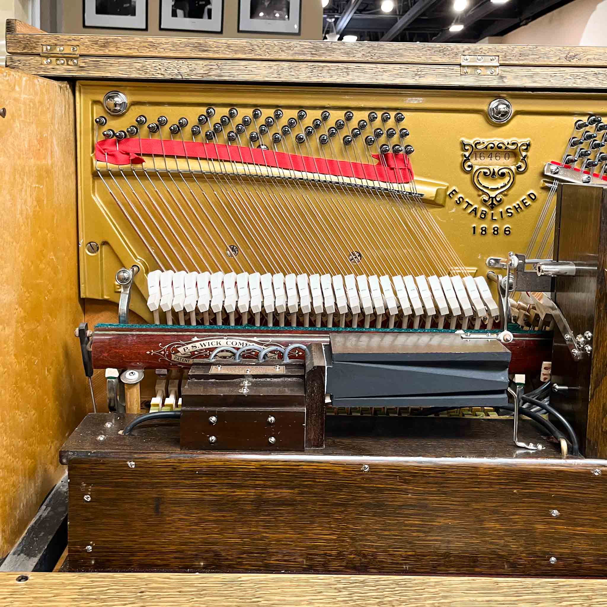 Beautiful upright heirloom hundred year old piano Shattuck vintage pnumatic player piano after restoration at Brigham Larson Pianos Family heirloom restoration shop in Orem, Utah.
