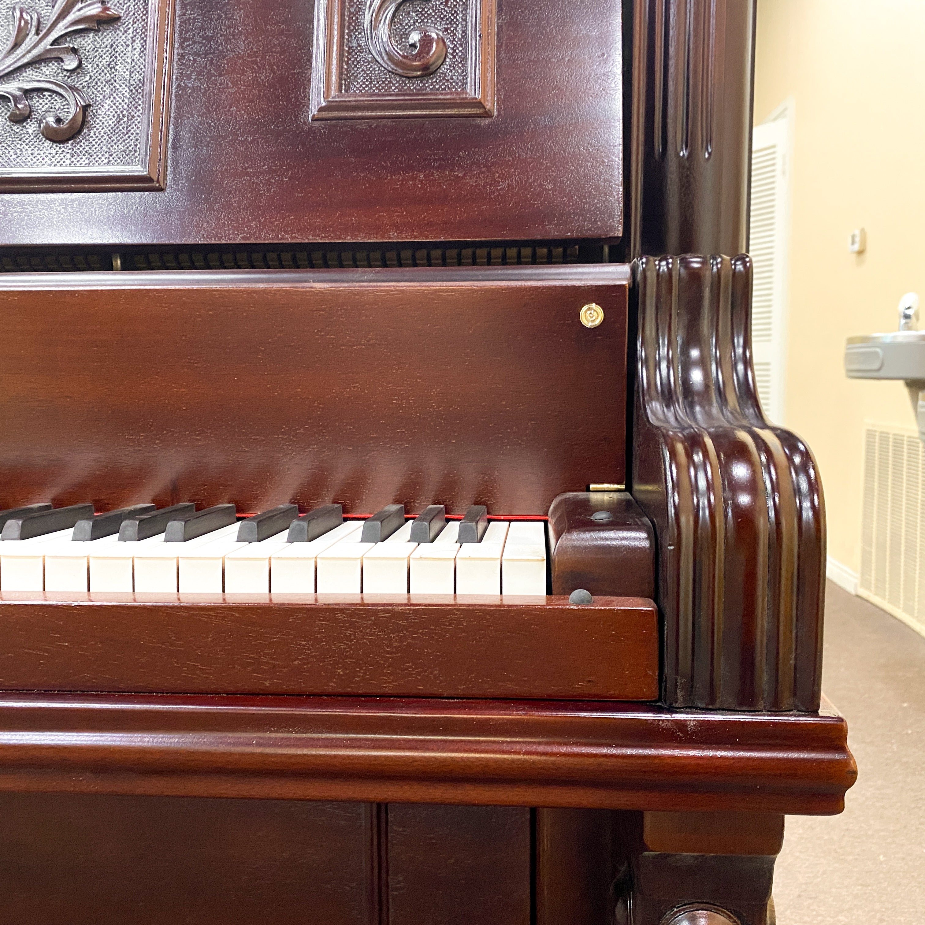 After piano restoration keys, piano hammers, piano action, piano plate, piano strings, piano tuning pins, photo of after the Schubert upright heirloom piano was restored and rebuilt and refinished to like new condition.