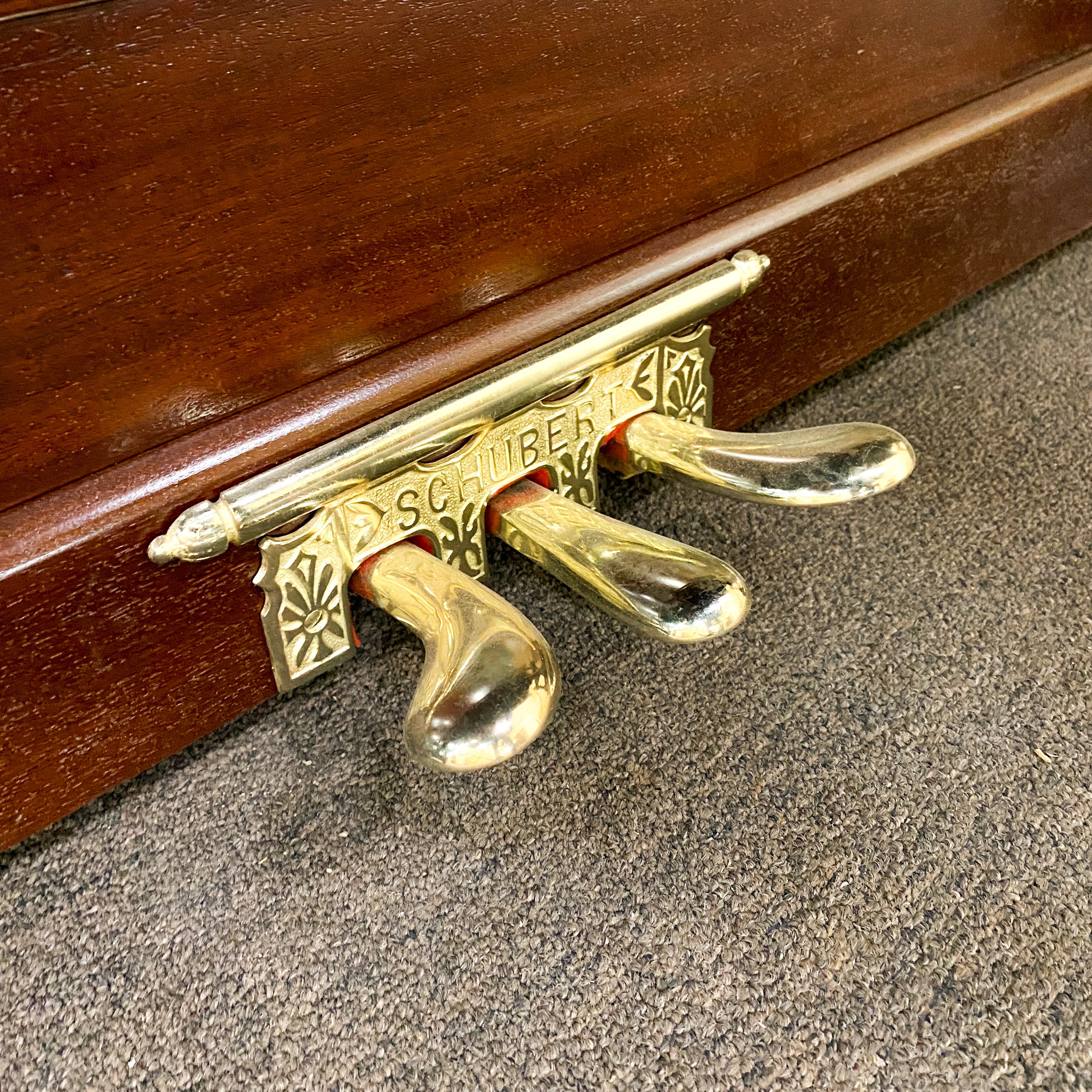 After pedal restoration and metal hardware replating piano hammers, piano action, piano plate, piano strings, piano tuning pins, photo of after the Schubert upright heirloom piano is restored and rebuilt and refinished to like new condition.