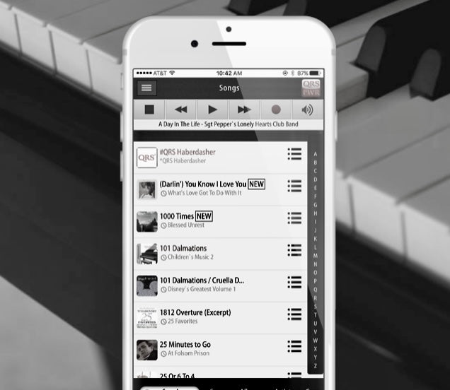 QRS digital piano player user on iphone playing the piano.
