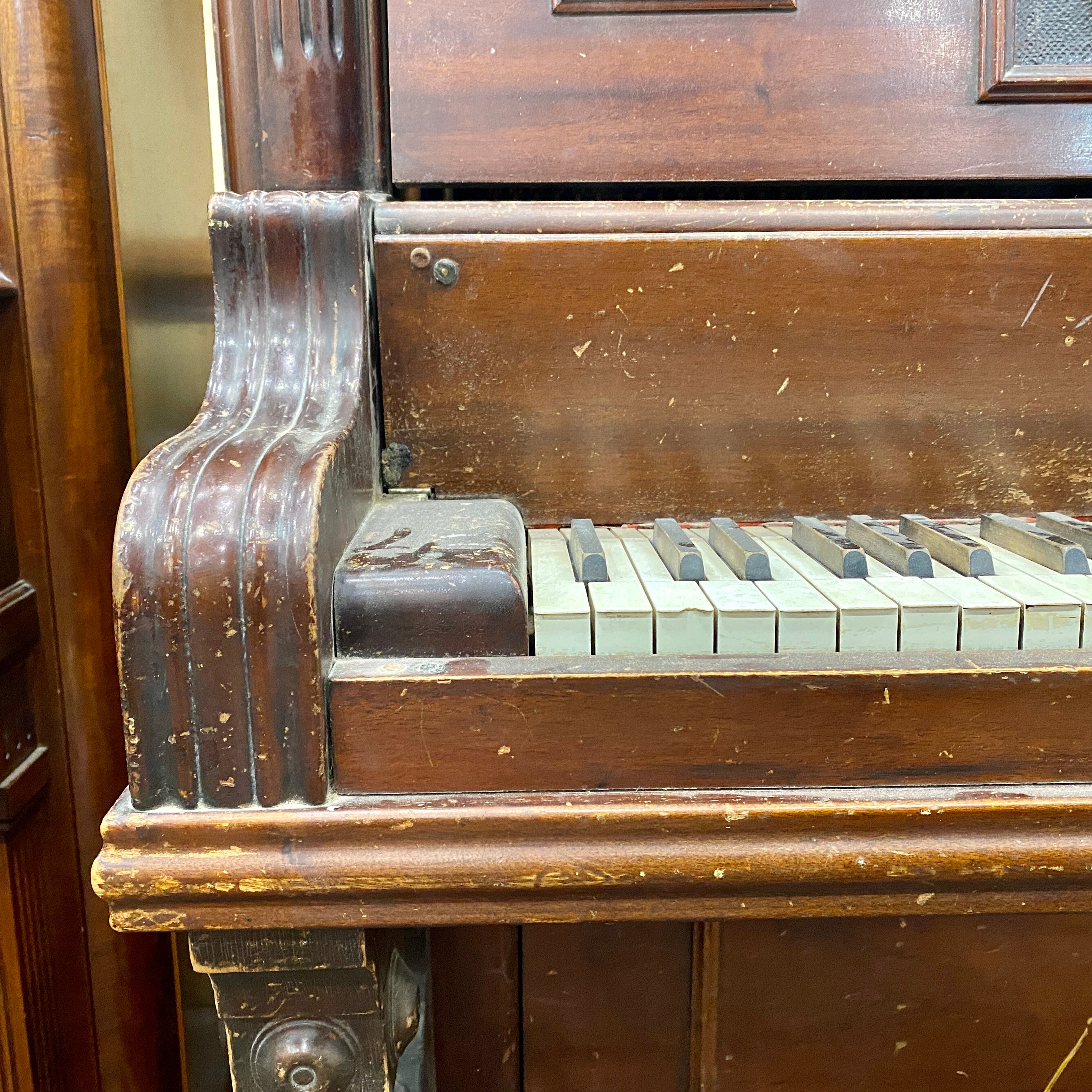 Before piano keys, piano hammers, piano action, piano plate, piano strings, piano tuning pins, photo of before the Schubert upright heirloom piano was restored and rebuilt and refinished to like new condition.