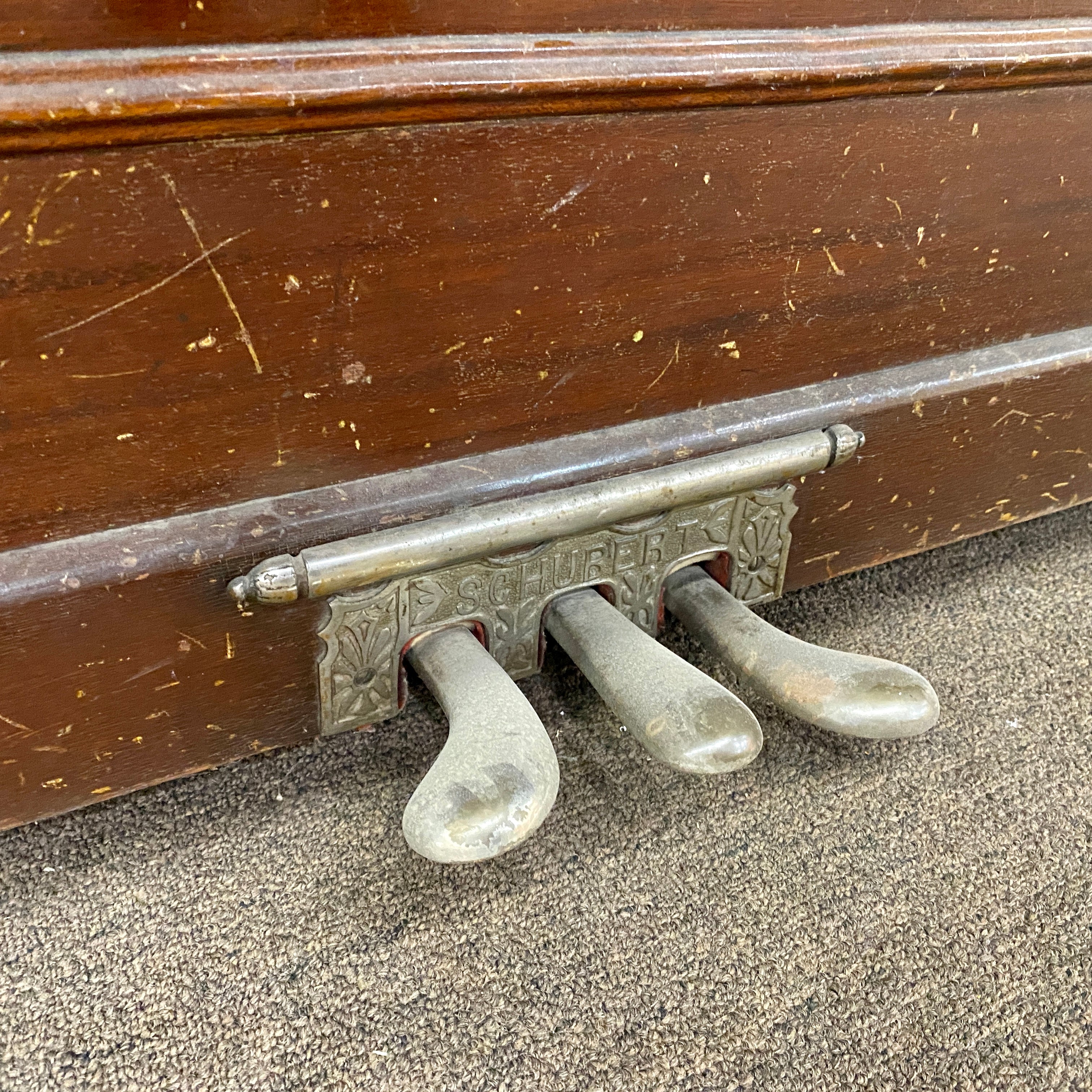 Before pedal restoration and metal hardware replating piano hammers, piano action, piano plate, piano strings, piano tuning pins, photo of before the Schubert upright heirloom piano is restored and rebuilt and refinished to like new condition.