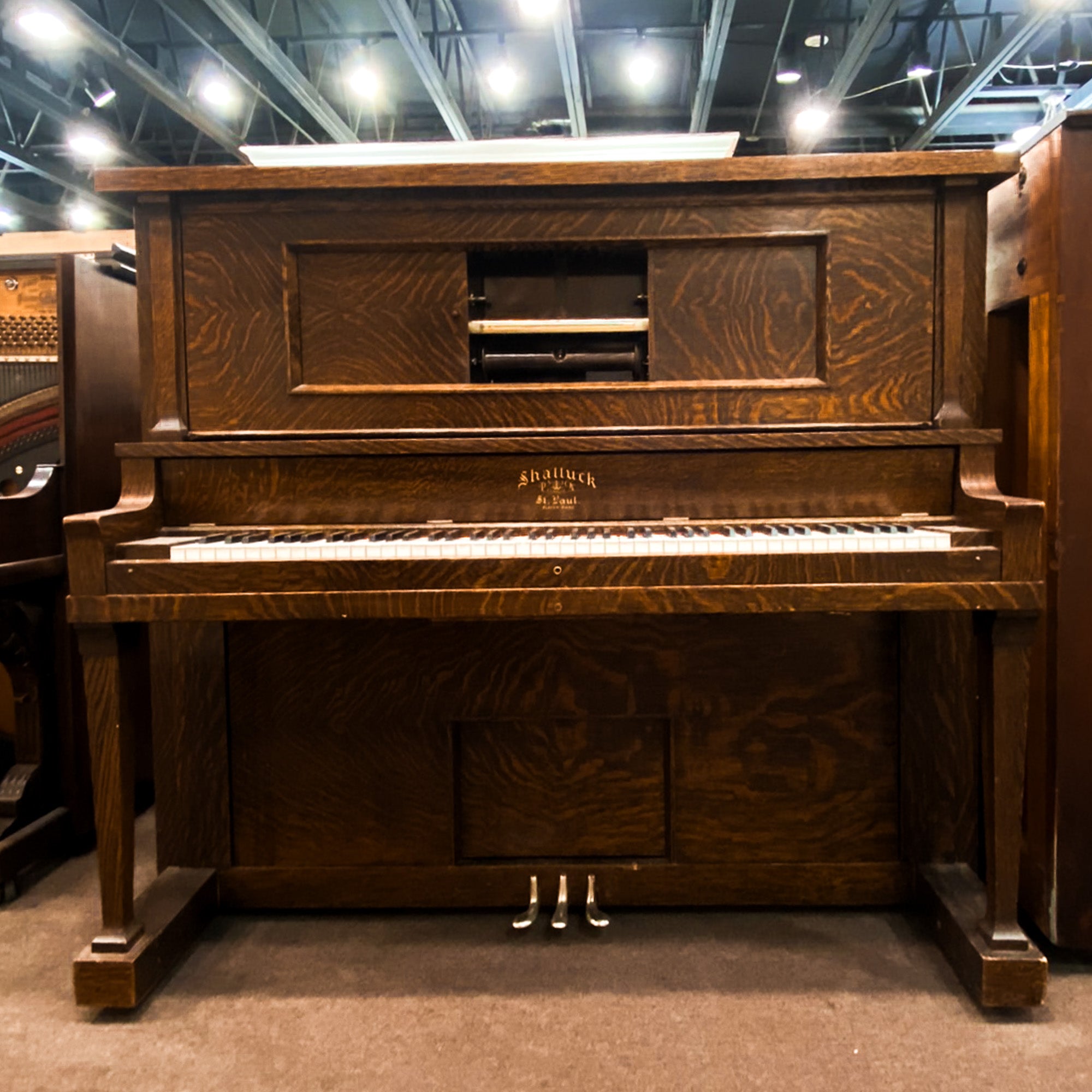 Beautiful upright heirloom Shattuck vintage pnumatic player piano before restoration at Brigham Larson Pianos Family heirloom restoration shop in Orem, Utah.