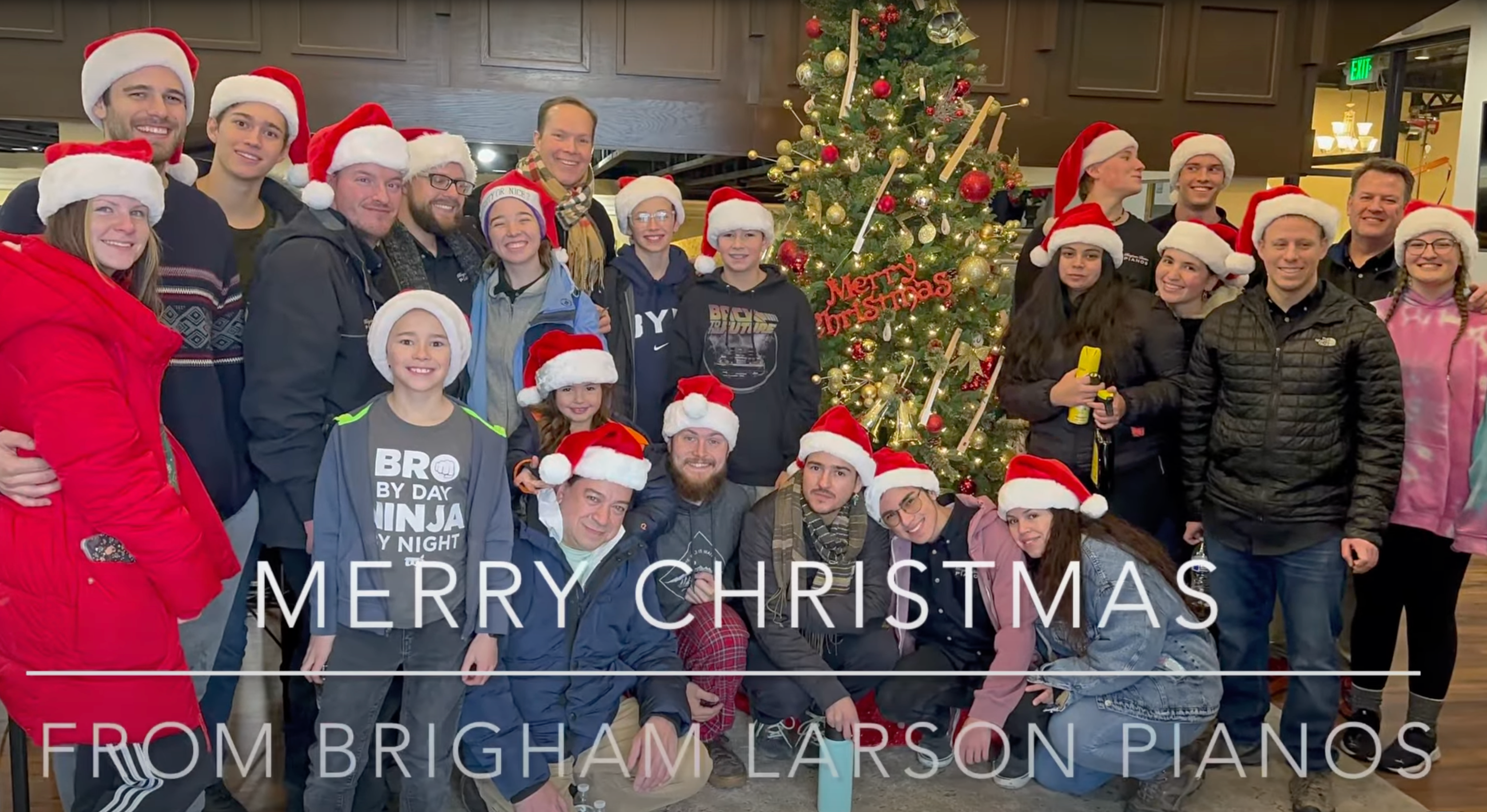 Load video: The piano restoration team at Brigham Larson Pianos ready for Christmas deliveries!